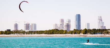 Doha, Qatar-February 14,2016 Kiteboarding on the waters of an artificial island called â€œThe...