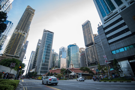 Singapore City,Singapore - September 08, 2019: Low wide-angle view looking up to modern skyscrapers in business district of Singapore City.のeditorial素材