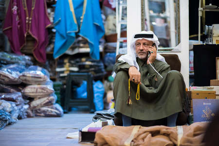 Doha,Qatar-February 15,2020 : Night views of shops and market vendors in the market Souk Waqif.のeditorial素材