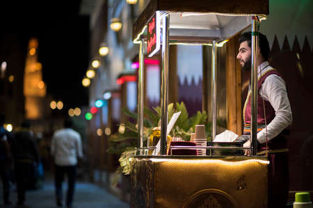 Doha,Qatar-February 15,2020 : Night views of shops and market vendors in the market Souk Waqif.のeditorial素材