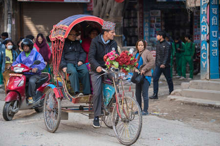 Kathmandu, Nepal - April 20,2019 : Cycle rickshaw on the streets of Kathmandu. In terai region of...
