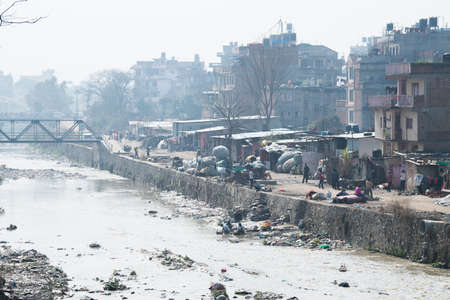 Kathmandu, Nepal,  April 20,2022 : Garbage and plastic pollution on the river bank in Kathmandu.