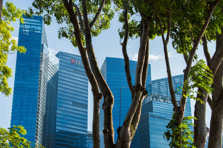 Singapore City,Singapore - May 01,2022: Low wide-angle view looking up to modern skyscrapers in business district of Singapore City.のeditorial素材