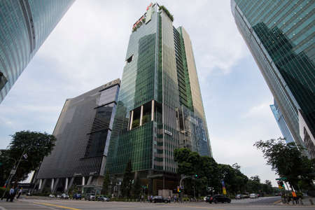 Singapore City,Singapore - May 01,2022: Low wide-angle view looking up to modern skyscrapers in...