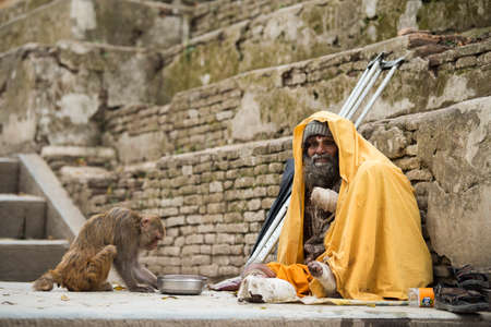 Kathmandu, Nepal- April 20,2019 : The cripple begs on the street of Pashupatinath Temple in Kathmandu, Nepal.のeditorial素材