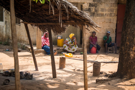 Zanzibar City, Tanzania - May 01,2022: Street view of the usual daily life of local people all ages...