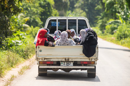 Zanzibar City, Tanzania - May 01,2022: Street view of the usual daily life of local people all ages taking place along the road on the Zanzibar Island in Tanzania.のeditorial素材