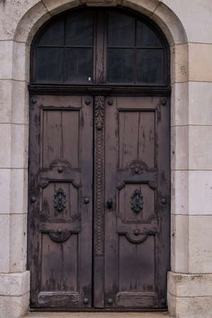 Munich, Germany - May 01, 2022: Old Decorative Main Entrance Wooden Door.のeditorial素材