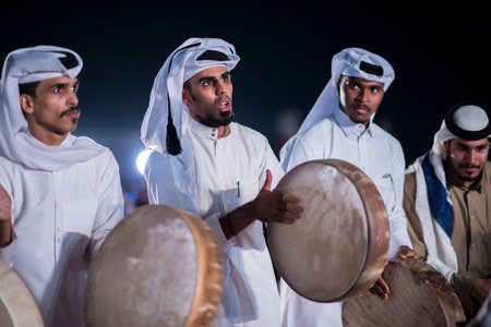 Doha, Qatar, December 18,2017: The drummers dressed in traditional clothes as part of a performance called the "ardha" sword dance at the Darb Al Saai, organized to celebrate Qatar National Day.のeditorial素材