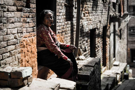 Kathmandu, Nepal- April 20,2019 : Portrait of older Nepalese in Patan Durbar Square.のeditorial素材