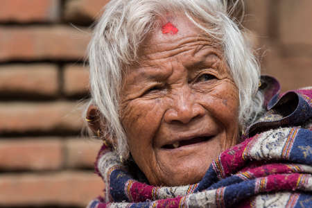 Kathmandu, Nepal- April 20,2019 : Portrait of older Nepalese in Patan Durbar Square.のeditorial素材