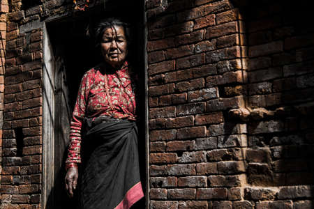 Kathmandu, Nepal- April 20,2019 : Portrait of older Nepalese in Patan Durbar Square.