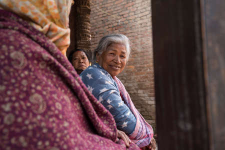 Kathmandu, Nepal- April 20,2019 : Portrait of older Nepalese in Patan Durbar Square.のeditorial素材