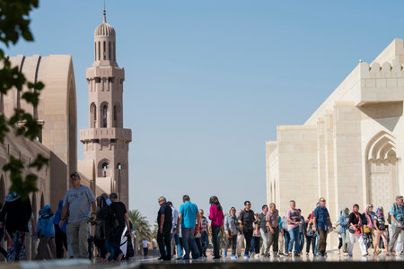 Muscat, Oman - March 05,2019 : Tourists tour in the Sultan Qaboos Grand Mosque.のeditorial素材