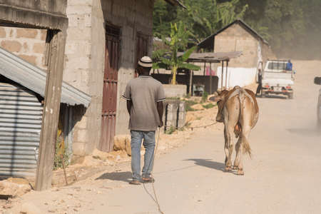 Zanzibar City, Tanzania - May 01,2022: Street view of the usual daily life of local people all ages taking place along the road on the Zanzibar Island in Tanzania.のeditorial素材
