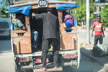 Zanzibar City, Tanzania - May 01,2022: Street view of the usual daily life of local people all ages taking place along the road on the Zanzibar Island in Tanzania.のeditorial素材