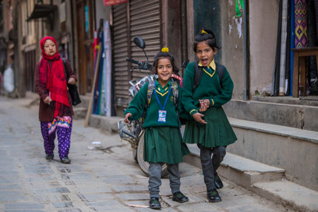 Kathmandu, Nepal- April 20,2022 : High school students dressed in school uniforms on the streets of Kathmandu.のeditorial素材