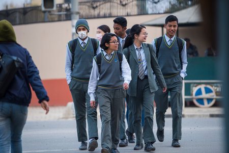 Kathmandu, Nepal- April 20,2022 : High school students dressed in school uniforms on the streets of Kathmandu.のeditorial素材