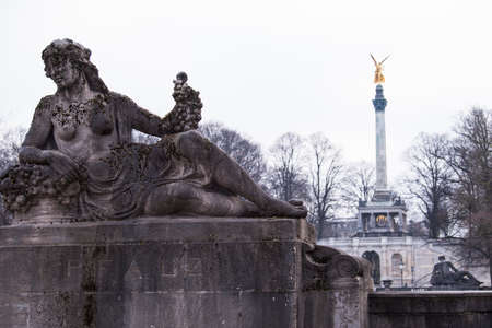 Germany, Munich- December 20,2021: A stone monument adorning the Munich bridge.のeditorial素材