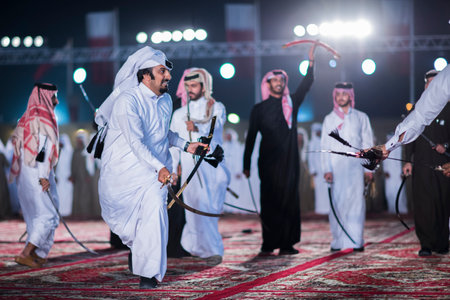 Doha,Qatar,December-18,2017: The sword dance called the "ardha" at the Darb Al Saai grounds, organized to celebrate Qatar National Day.のeditorial素材
