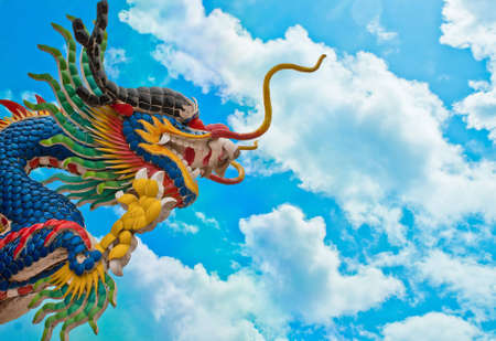 Chinese style dragon statue on blue skyの写真素材