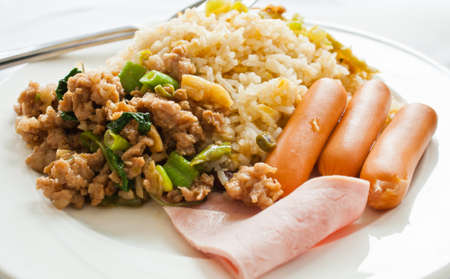 Fried rice with pork sausage and hamの写真素材