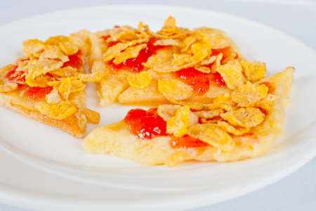 Bread and cereal with strawberry jamの写真素材