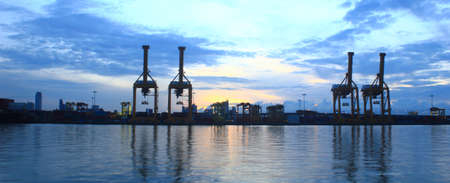 Panorama of Industrial Container Cargo freight ship with working crane for Logistic Import Exportの写真素材