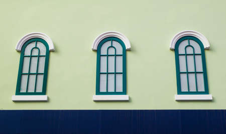 Vintage windows on Green wallの写真素材