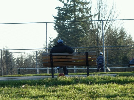 Man resting on a benchの素材