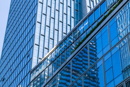 A skyscraper from a low angle view in the modern city of Chinaのeditorial素材
