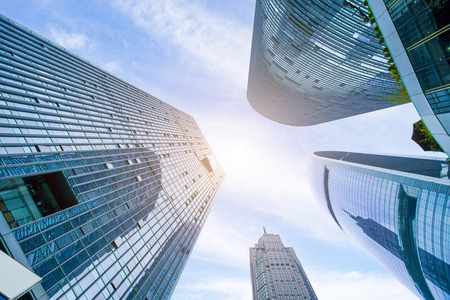 Low angle view of urban buildings in the cityの写真素材