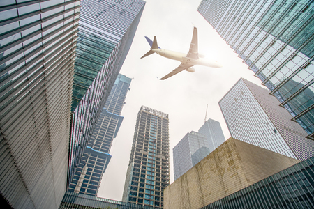 Low angle view of urban buildings in the cityの写真素材
