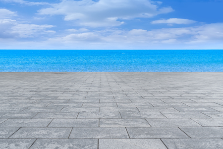 Urban square with sea and clear skyの写真素材