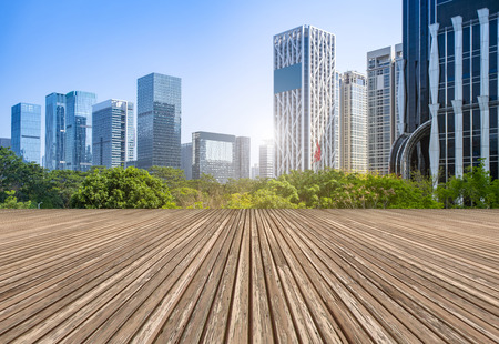 Urban skyscrapers with empty square floor tilesの写真素材