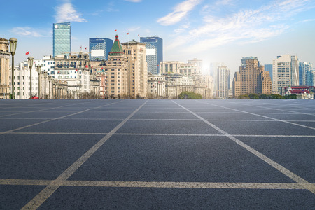 Highway asphalt road and commercial office buildingの写真素材