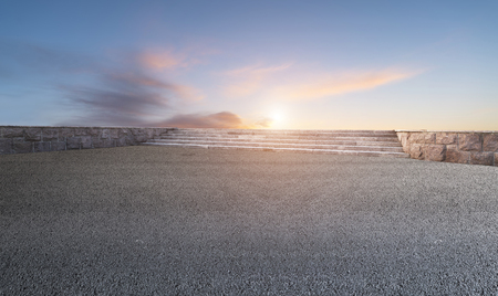 Asphalt road and sky evening cloudsの写真素材
