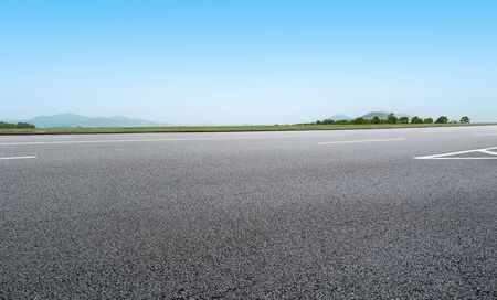 Asphalt highway under the blue skyの写真素材