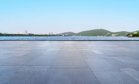 Road and blue sky with white cloudsの写真素材