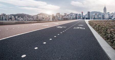 Road pavement and city buildings skylineの写真素材