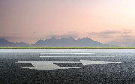Road and distant mountain landscapeの写真素材