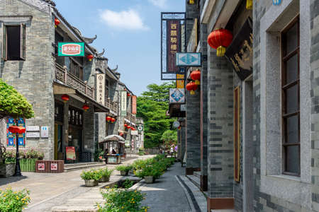 Guangzhou, China-September 17, 2019: Traditional Chinese shops and buildings in Lingnan Impression Park, a famous tourist destination in Guangzhou.のeditorial素材