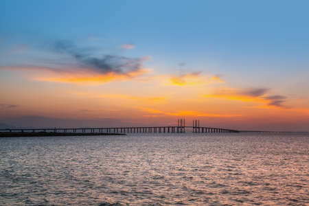 Sunset and cross sea bridgeの写真素材