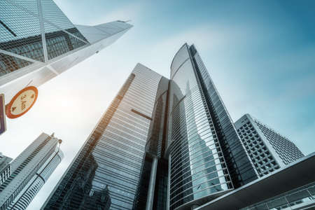 Skyscrapers and glass facades in Central Street, Hong Kongの写真素材