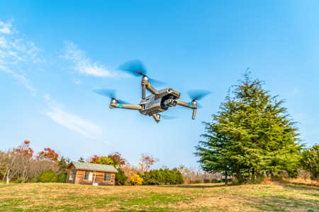 Drones flying in city parksの写真素材