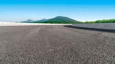 Road ground and distant mountains backgroundの写真素材