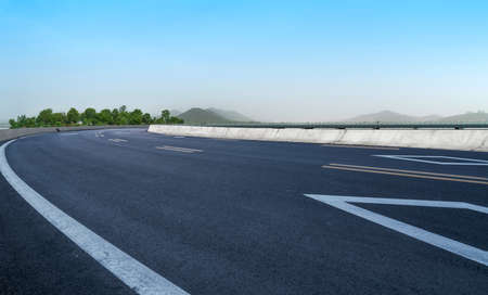 Highway skyline and distant mountains backgroundの写真素材