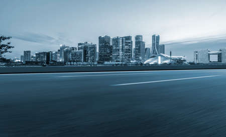 Asphalt road and urban architectural landscape