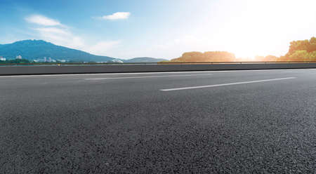 Road ground and distant mountains backgroundの写真素材