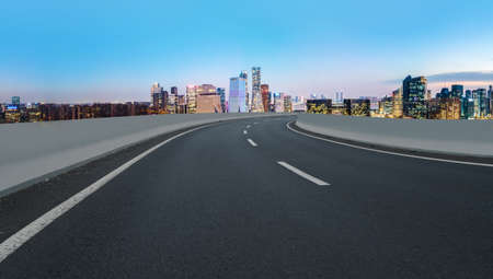 Asphalt road skyline and city modern buildings landscapeの写真素材